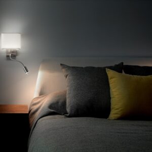 cozy-bedroom-interior-with-pillows-and-reading-lamp