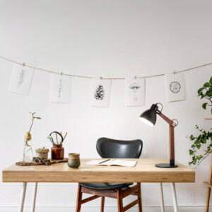 stylish-scandinavian-home-interior-of-open-space-with-a-lot-of-plants-design-accessories-bamboo-shelf-wooden-desk-and-hanging-mock-up-forest-drawings-botany-concept-of-home-decor-sunny-room